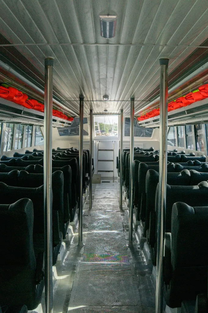 Comfortable interior cabin seating area of boutique Speedboat C Labuan Bajo