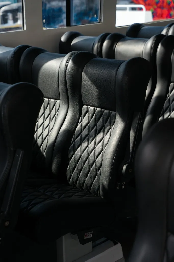 Premium black leather seats with quilted pattern inside Speedboat C Labuan Bajo