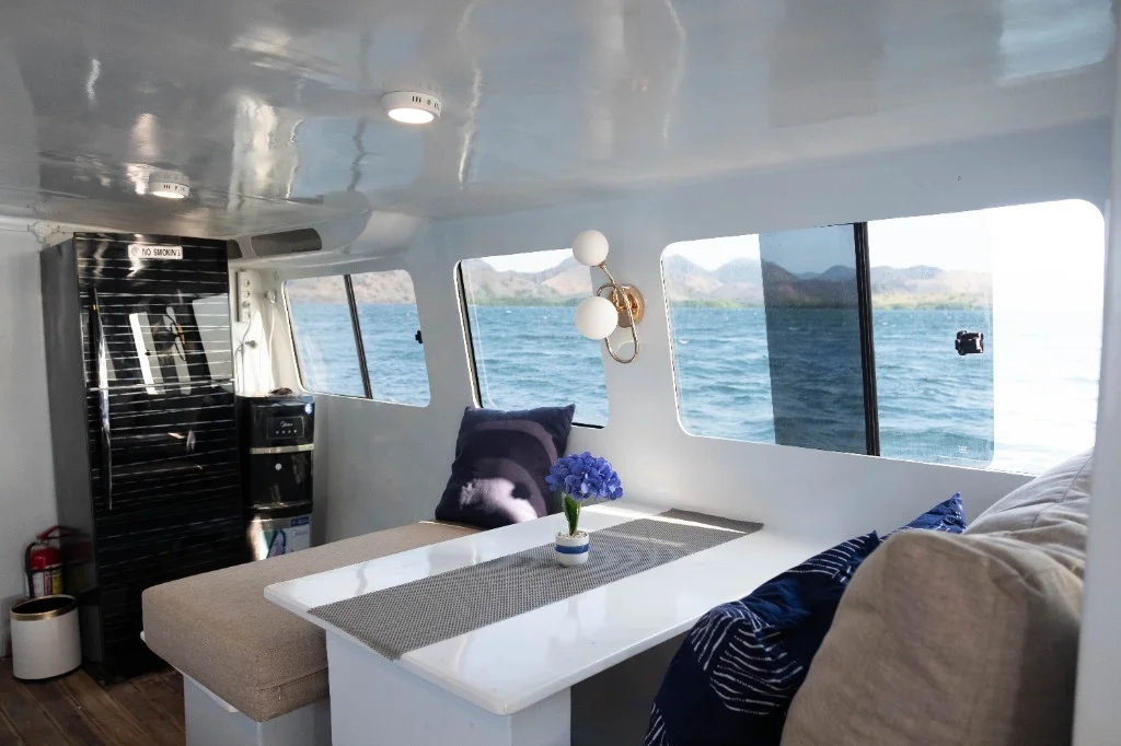 Modern interior dining area of Speedboat D with sea view