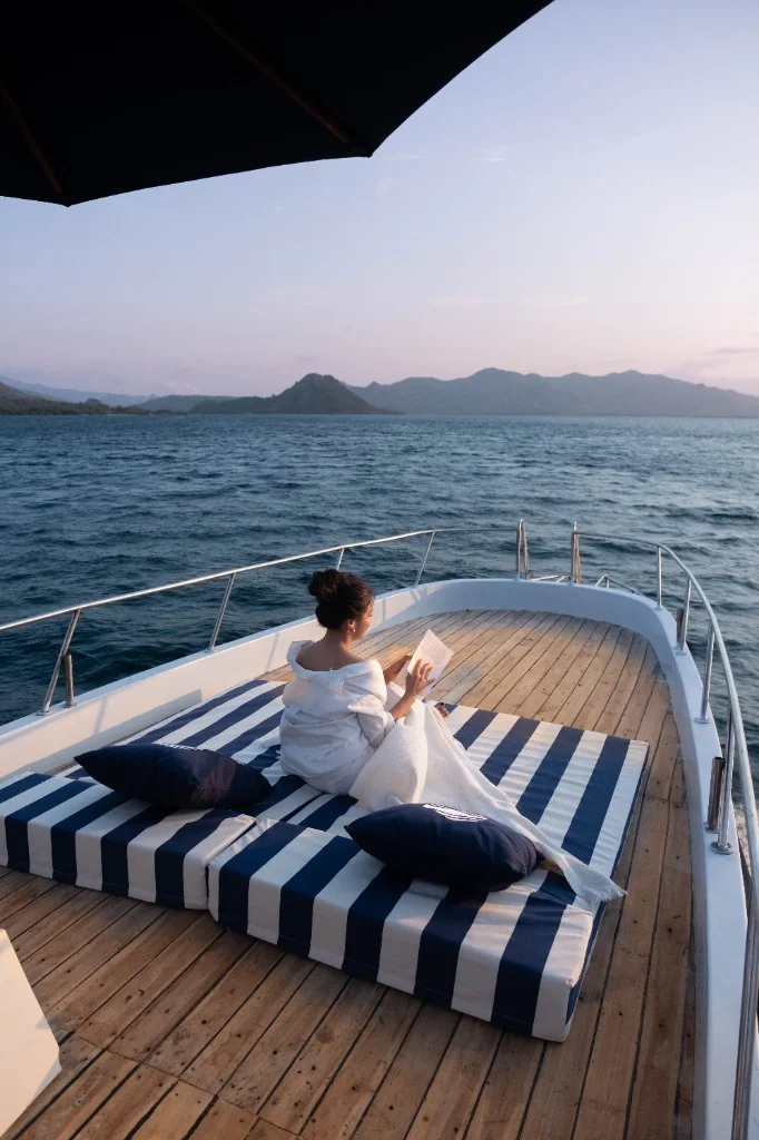 Sun deck relaxation area on Speedboat D with comfortable cushions